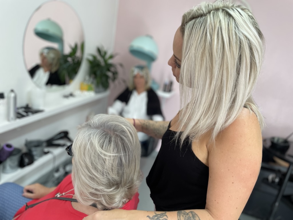 Chantelle, colour specialist and owner, styling a client at Kiss & Tell Hair Studio in Pinelands